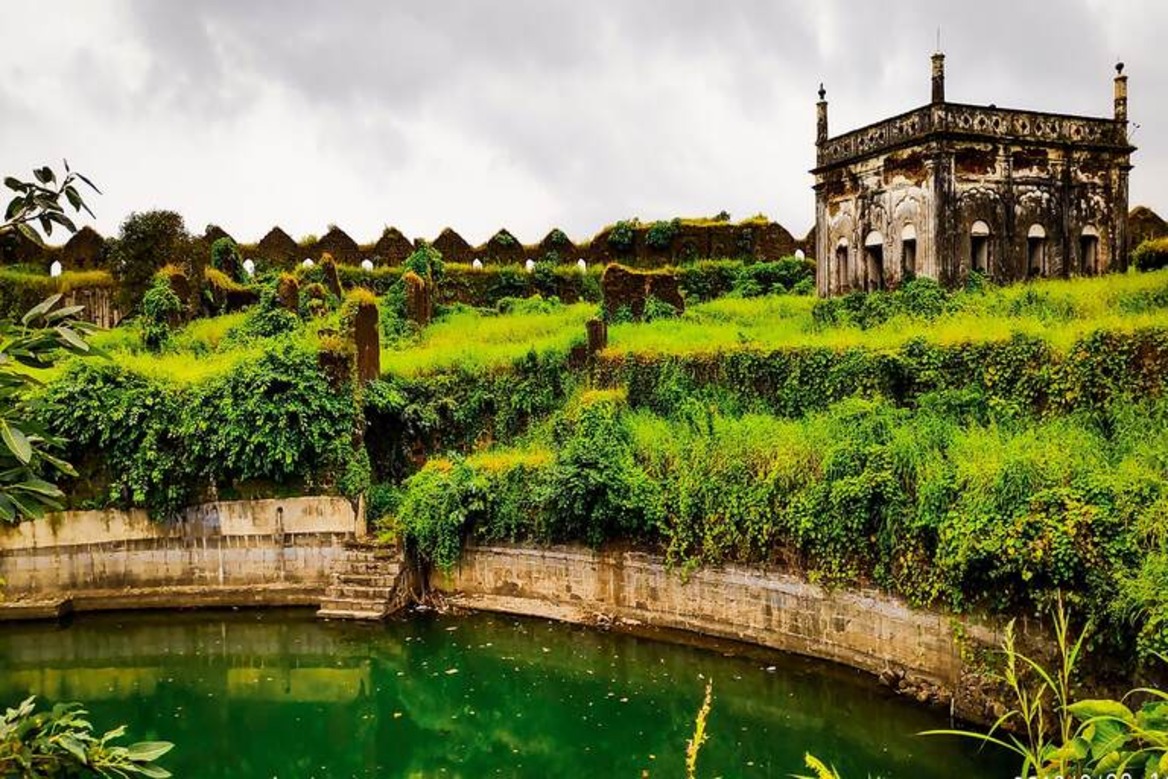 "View of Janjira Fort, a historic sea fort located off the coast of Maharashtra, India, with its imposing stone walls and turrets surrounded by the Arabian Sea."